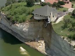 House falling off cliff at Lake Whitney